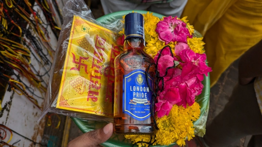 devotees offer alcohol at kal bhairava temple ujjain